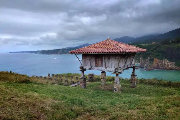 Asturian granary facing the sea in Cadavedo in Cadavedo, Asturias, Spain
