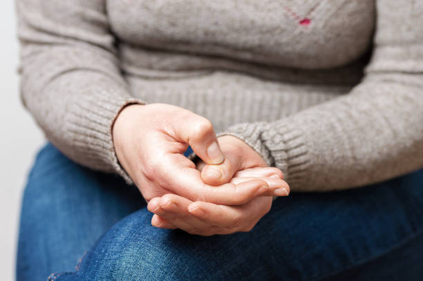 istock woman sitting on a sofa and feeling anxious 1304286299