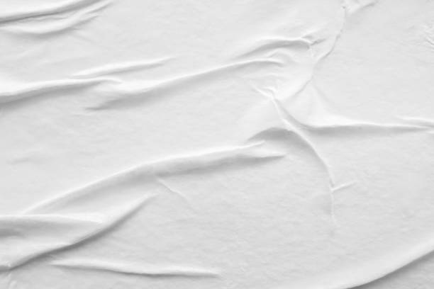 istock Blank white crumpled and creased paper poster texture background 1304287163