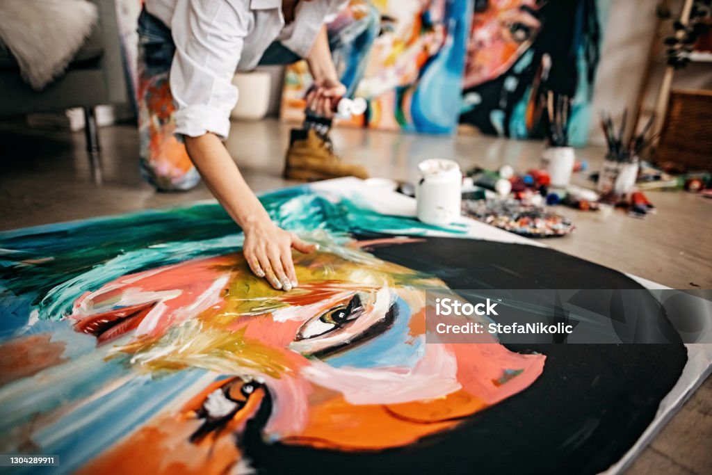 My vision of female face Female artist painting portrait on canvas Art Stock Photo