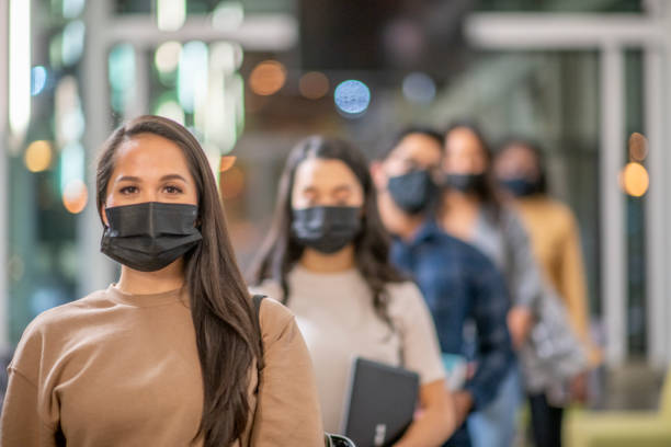 istock Beautiful Masked University Student Stock Photo 1304293594