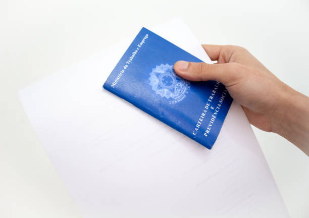 istock Hand holding Brazilian work card 1304297719
