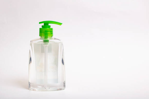istock Transparent bottle with soap on gray background 1304315174