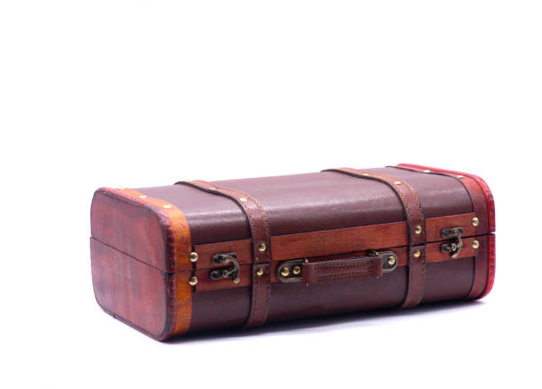 istock Retro suitcase and book on white background 1304316319