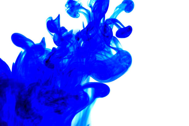 istock blue ink in water on white background.Blot ink. Blue abstract paint on a white background.Color swirling. 1304317147
