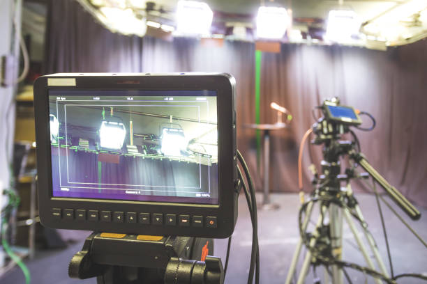 istock Professional film camera on tripod, broadcasting studio, spotlights and other recording equipment 1304319144