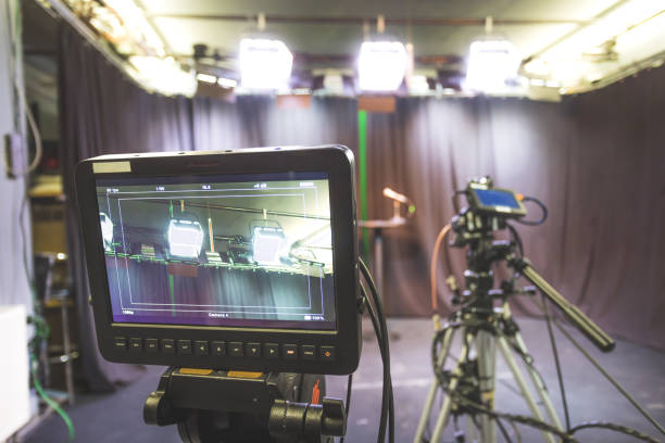 istock Professional film camera on tripod, broadcasting studio, spotlights and other recording equipment 1304319166