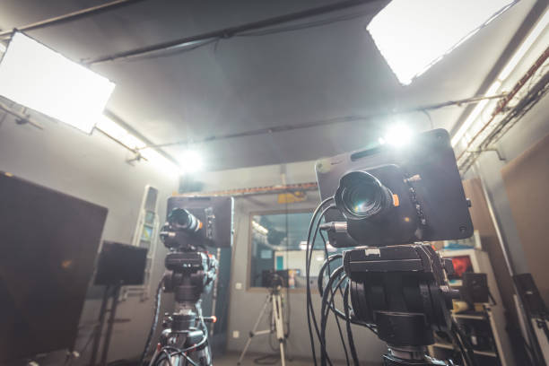 istock Professional film camera on tripod, broadcasting studio, spotlights and other recording equipment 1304319214