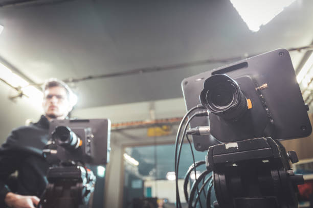 istock Cameraman operates a film camera, broadcasting recording studio 1304319232