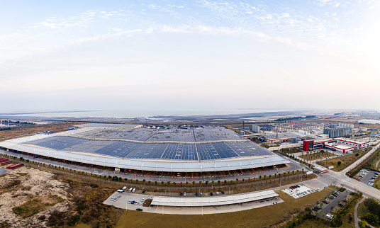 Aerial view of solar power plant on the roof of an industrial plant