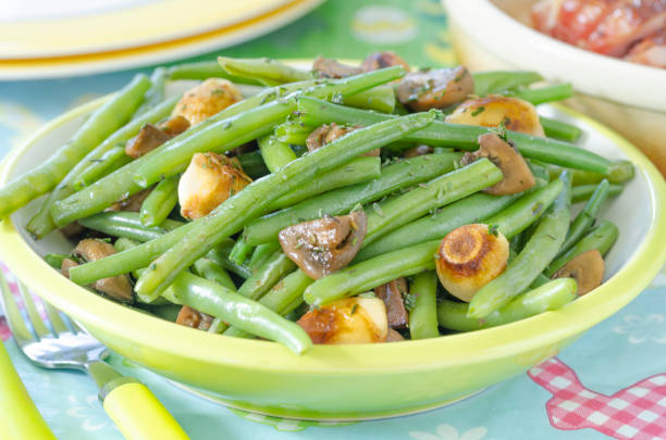 istock Sauteed green beans with caramelized onions and mushrooms 1304326629