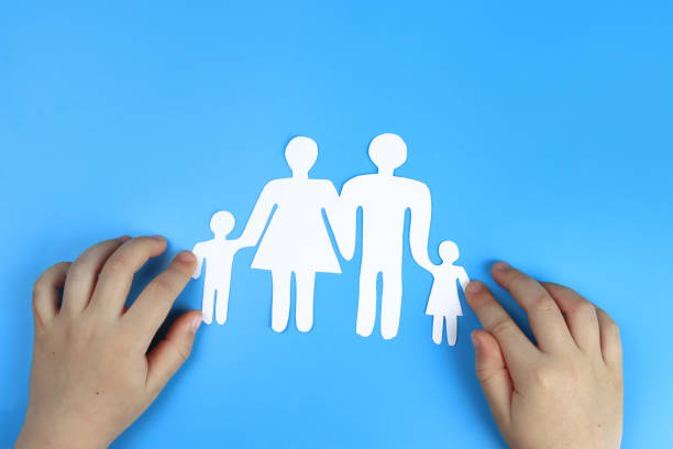 istock Baby's hands support Paper family 1304328081