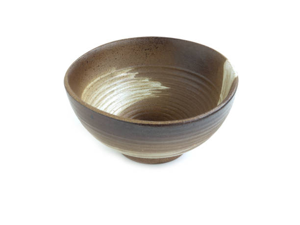 istock Empty old brown clay bowl with white stripe isolated on a white background. Japanese style, Use for home or restaurant, food design. Kitchen accessory. 1304329863
