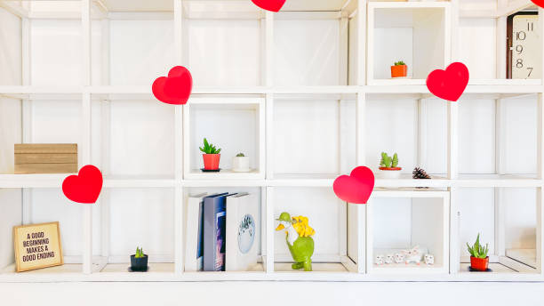 istock White bookshelf on the wall decorated with red hearts 1304330789