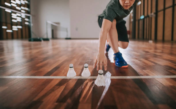 istock Low angle asian chinese badminton players practicing in badminton court endurance training 1304335748