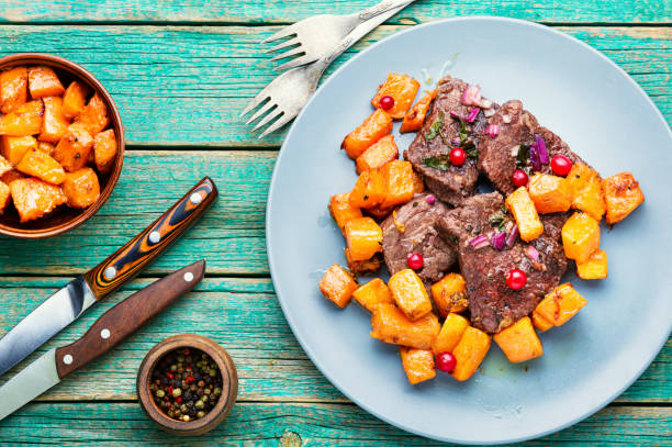 istock Beef stew with pumpkin on wooden table 1304339569