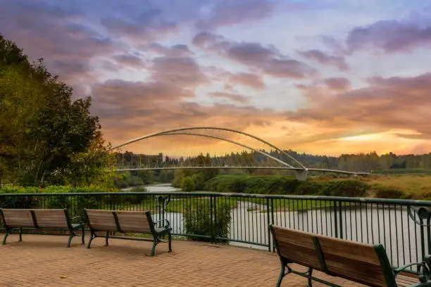 Photo of Park benches along Willamette River at Riverfront City Park in Salem OR sunset