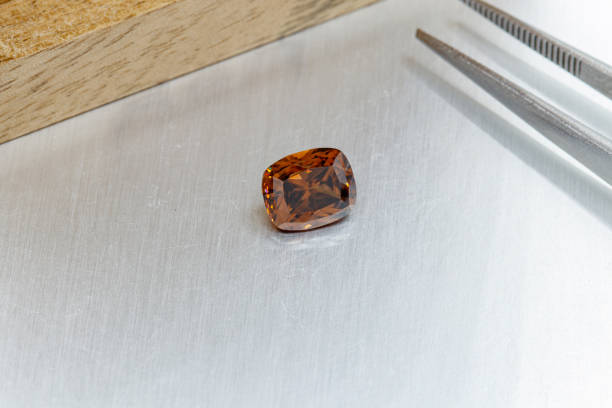 istock macro mineral faceted stone cut Zircon on a gray background 1304341655