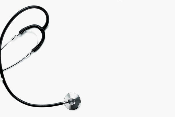 Black and silver colored doctor stethoscope isolated on white background with copyspace top view