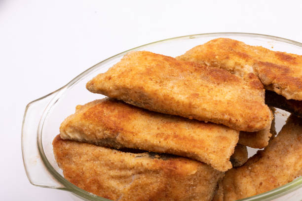 istock Breaded fish fillets in a glass, heat-resistant dish 1304342889