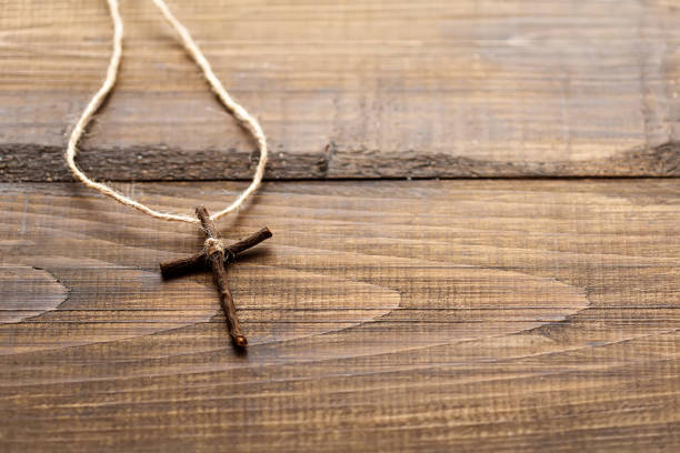 istock Christian cross on a wooden surface 1304344005