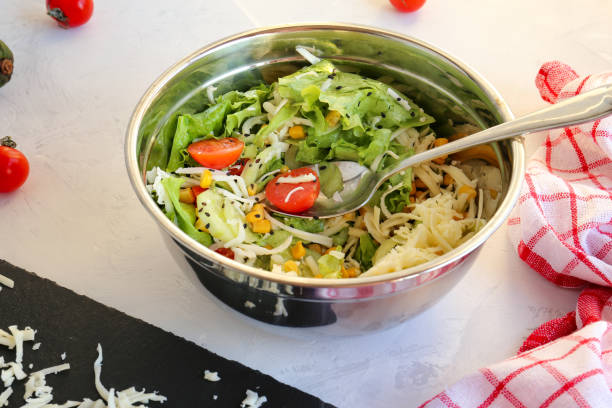 istock Dietary vegetable salad in a bowl on a white background 1304345359