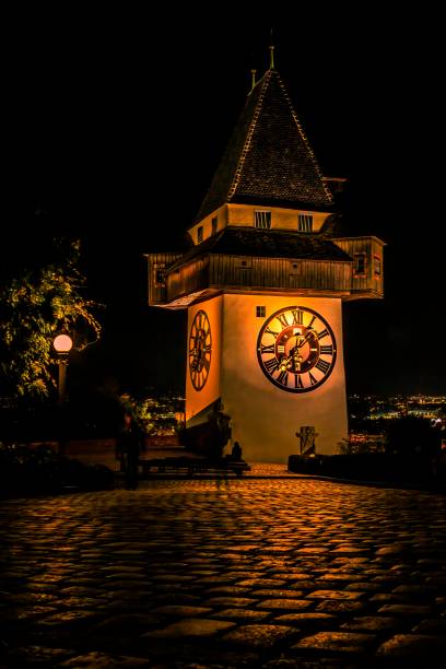 grazer uhrturm (am schlossberg) at morning, styria, austria - graz clock tower clock austria photos et images de collection