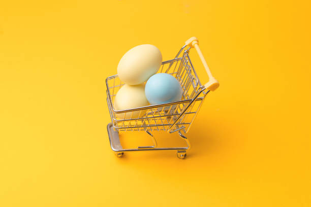 istock Top view photo of shopping trolley with easter eggs with copyspace. 1304347685