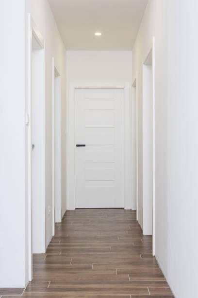 istock Hallway with white closed doors 1304349557