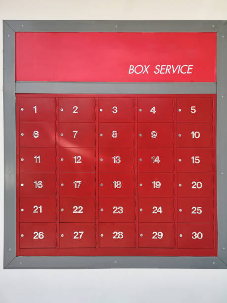 istock post office mailbox box service screen white text number one to thirty on front red steel with key Mortise lock, strack in the row 1304351145