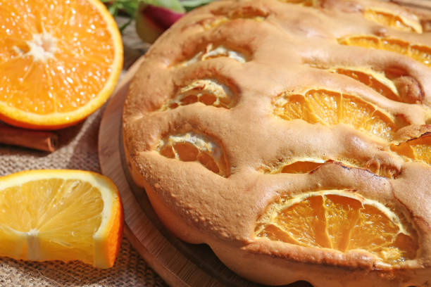 istock Orange Homemade Cake with sunshine close up 1304351969