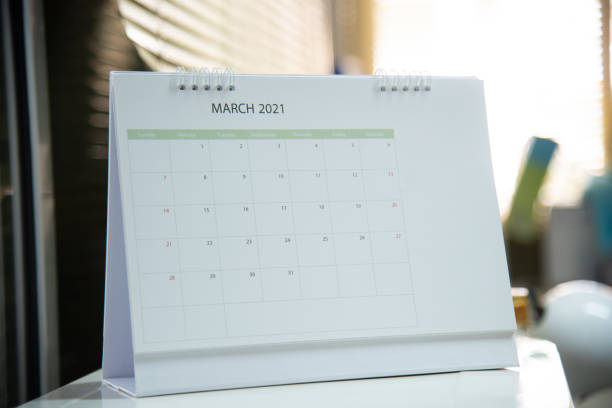 istock Blurred calendar in  white tone planning 2021 concept. 1304353349