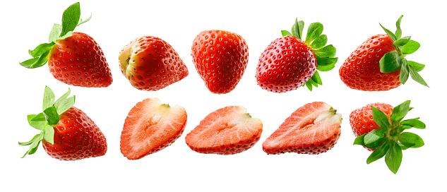 Close-up of ripening strawberries on the vine.\n\nTaken in  Watsonville, California, USA