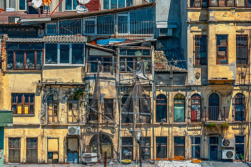 05/26/2019 Istambul, a view of colorful buildings in a very poor condition by the Ferry terminal Karakoy (Turyol). in the old and most tourist and popular city of Istanbul. tourist image as a postcard