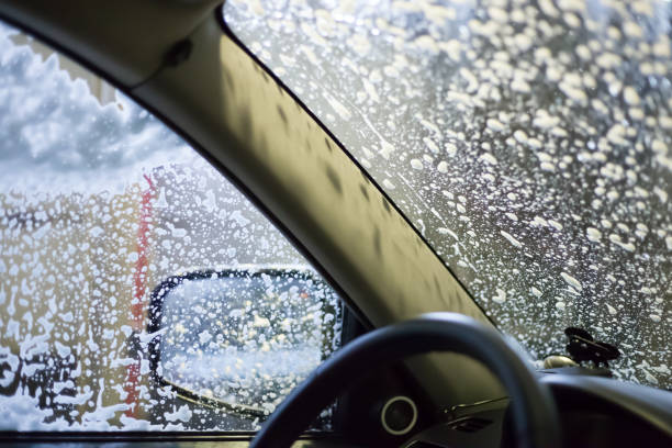 istock car wash, soap foam on glass 1304358742