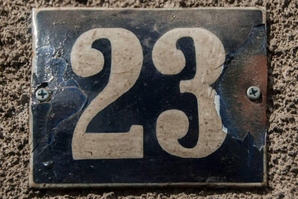 istock Weathered enamelled plate number 23 1304358957