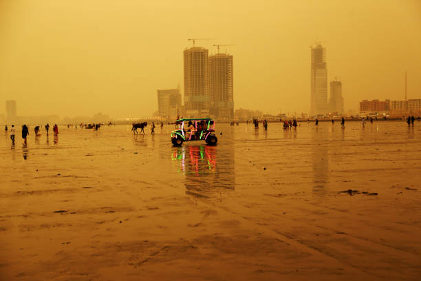 Karachi – Pakistan: Beach goers riding on a locally made beach buggy at Clifton beach