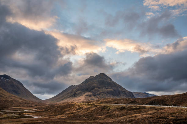 istock Majestic landscape image view down Glencoe Valley in Scottish Highlands with mountain ranges in dramatic Winter lighting 1304361078