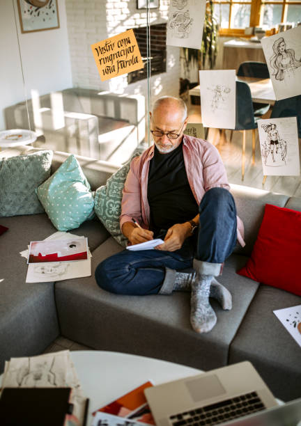 istock Senior Artist doing sketches for new art project 1304361555