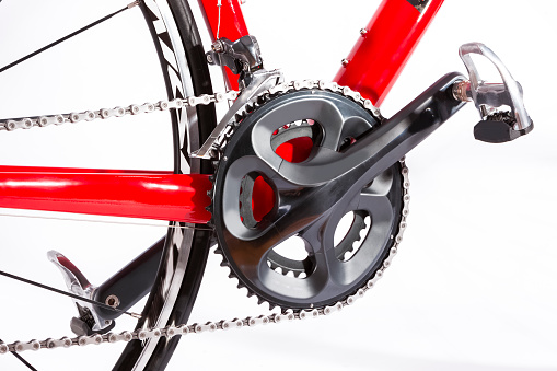 Cycling Ideas. Closeup of Crankset with New Chain. Against White. Horizontal Image Orientation