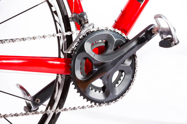 Cycling Ideas. Closeup of Crankset with New Chain. Against White. Horizontal Image Orientation Cycling Ideas. Closeup of Crankset with New Chain. Against White. Horizontal Image Orientation chainring stock pictures, royalty-free photos & images