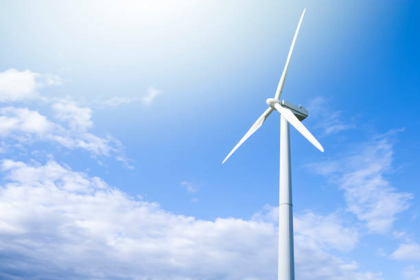 istock Alternative Energy Concepts. Windmill Outdoors Against Blue Sky. Horizontal image 1304367011