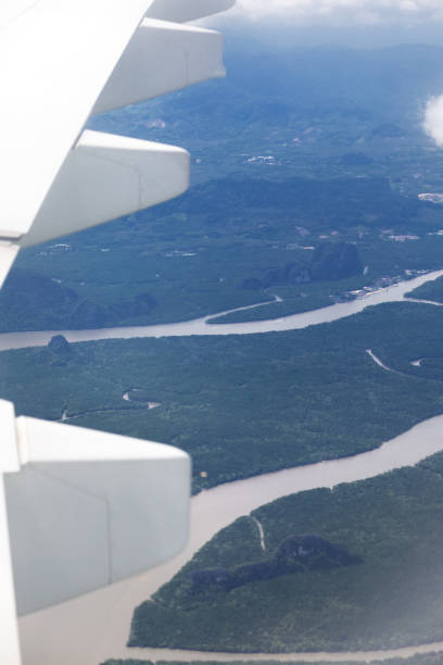 istock Airplane wing over Phuket island 1304369932