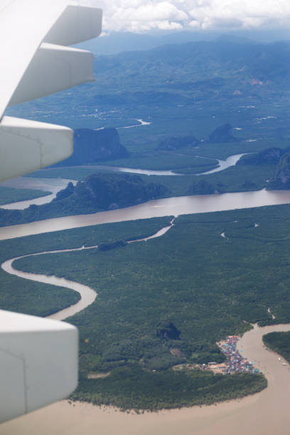 istock Phuket seen from airplane approaching island 1304369995