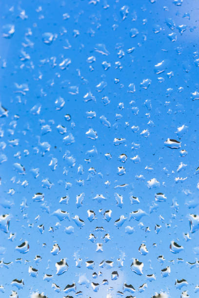 istock Abstract Texture Consisted of Water Droplets on Glass Surface. Vertical Composition 1304371183