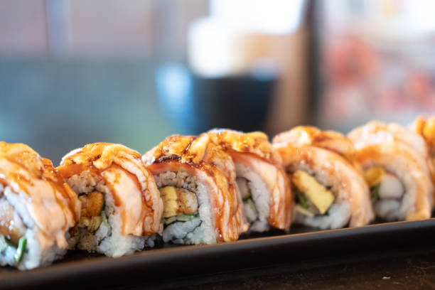 istock Salmon Engawa roll served on the black tray. Selective focus. 1304371301