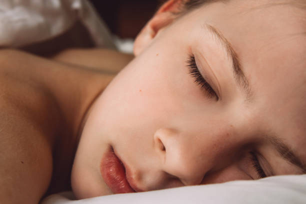 istock Girl sleeping in bed 1304372084