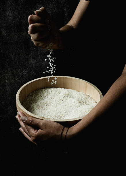 Plain rice in a typical Japanese wooden tub hangiri stock photo