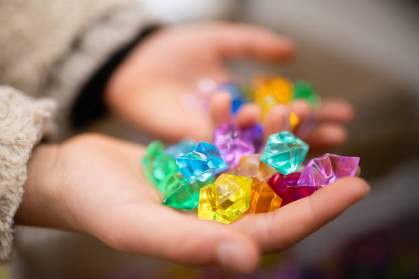Hand of a child with many beads