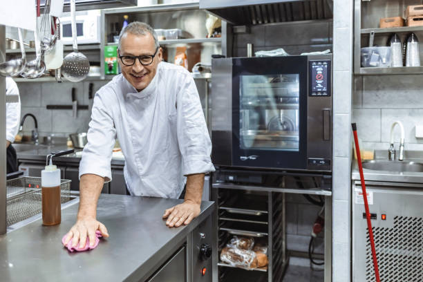 istock Male professional cook cleaning in commercial kitchen 1304380099
